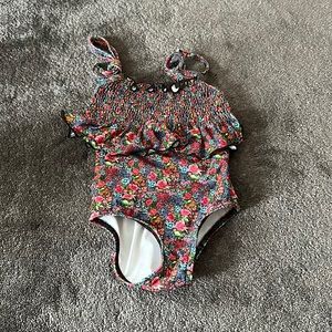 Adorable girls smocked bathing suit. Designer.